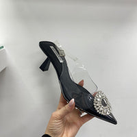 Décolleté trasparente con gioiello