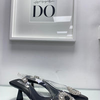 Décolleté trasparente con gioiello