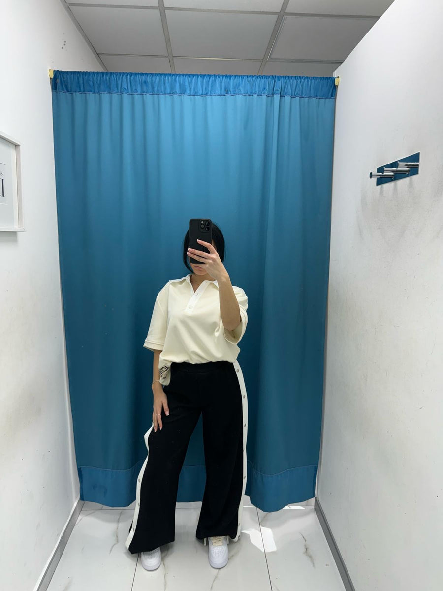 Pantalone con bottoni laterali 96536