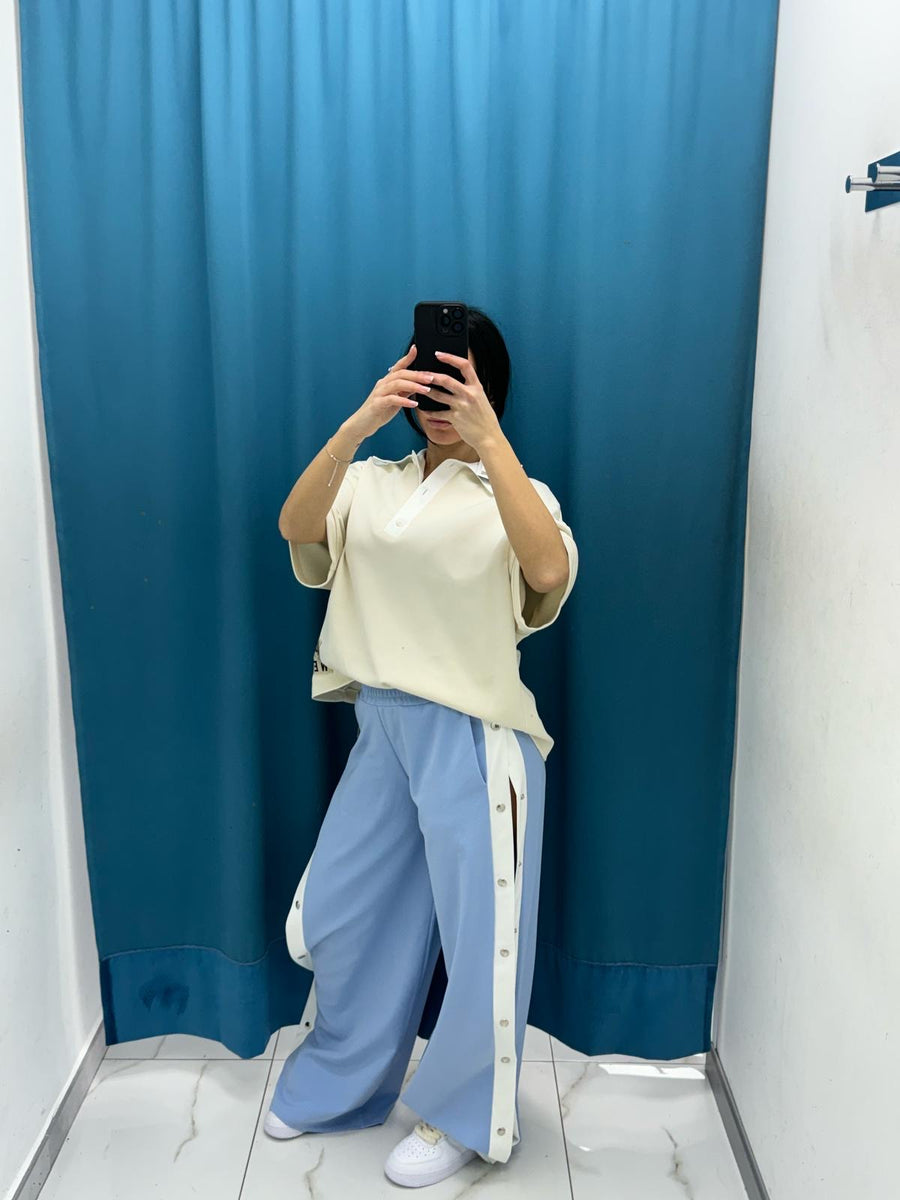 Pantalone con bottoni laterali 96536