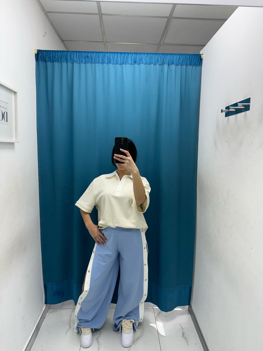 Pantalone con bottoni laterali 96536